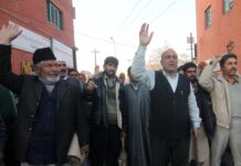 Sarpanchs and Panchs of Budgam district in Central Kashmir hold a protest demonstration in Srinagar on Thursday while demanding no security cover to the Panchayat representatives. photo by bilal bahadur