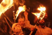 JKLF holds Torch Protests Activists and supporters of Jammu Kashmir Liberation Front (JKLF) hold torches during a protest march to mark International Human Rights Day in Srinagar -- Photo: Bilal Bahadur.