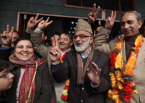 Ali Mohammad Sagar celebrating the victory of Coalition candidates. Monga and Dar are also in the picture. -- Photo: Bilal Bahadur