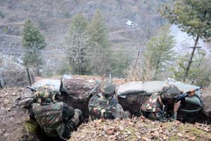 Soldiers watching their counterparts on the other side of the divide : Photo: Abid Nabi Soldiers watching their counterparts on the other side of the divide : Photo: Abid Nabi