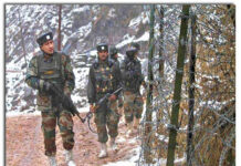 Soldiers patrolling near LoC Fence