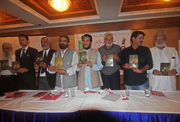 Nayeem Khan and Shabir Shah releasing Afzal Guru's memoir during a function in Srinagar.