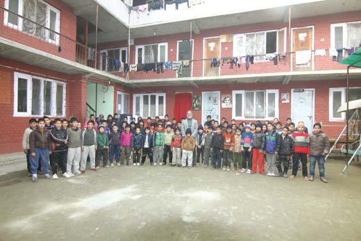 Dr Mushtaq with students at the junior boys hostel in Natipora.Pic: Bilal Bahadur
