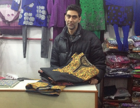 Basharat Hussain Khan at his shop in Maharaja Bazar with pieces of revived Pherans.