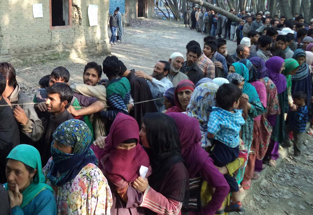 Curious Queue:  In Sonawari belt in North Kashmir, locals were seen standing in a queue since the early morning.  