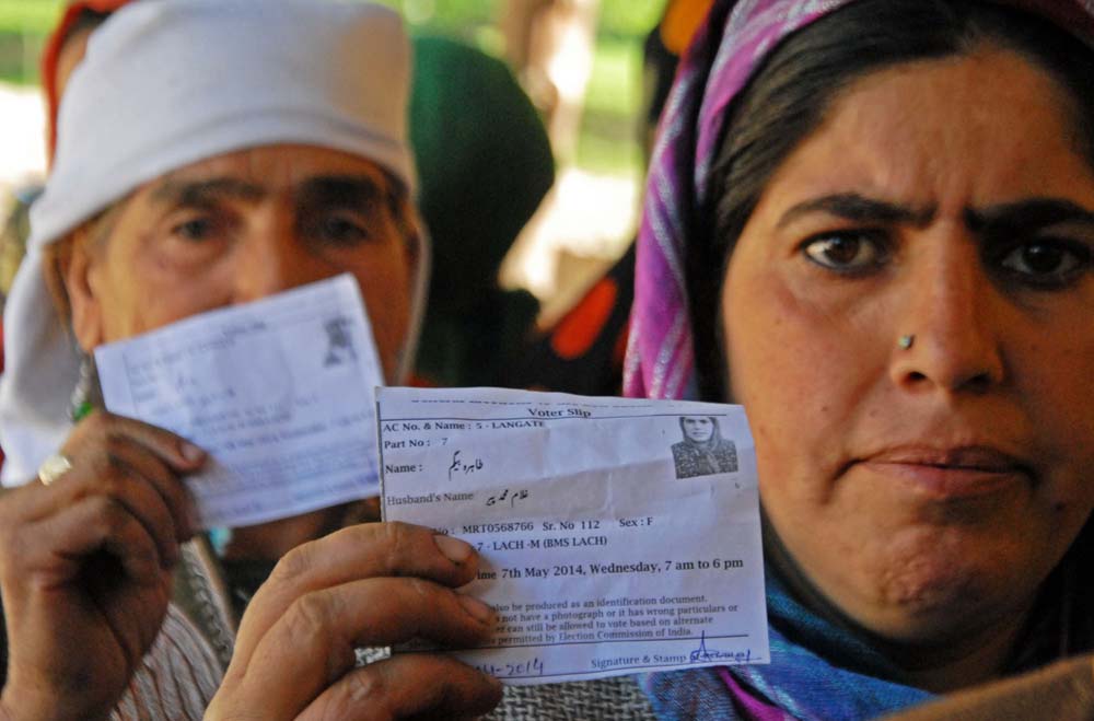 Displaying Identity: In Handwara town, these women were tirelessly waiting for their turn to cast vote. 