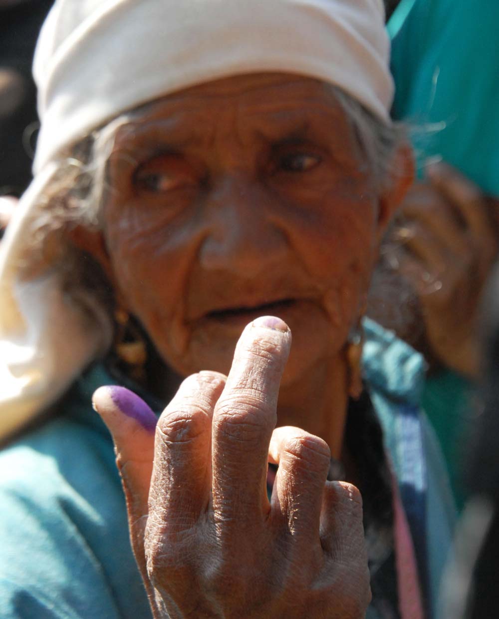 Grand Vote: An elderly lady from the village of Handwara coming out of poll booth after casting her vote. 