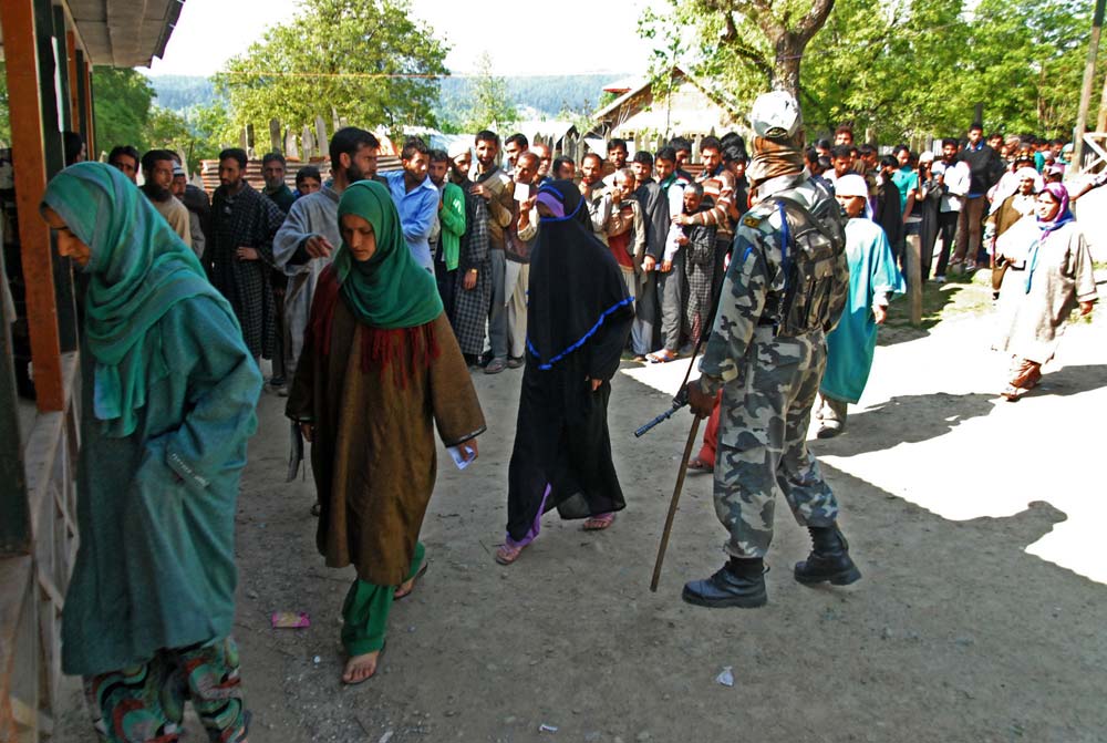 Poll Fever: In one of the polling booth in Handwara, young ladies stepping inside to exercise their vote.