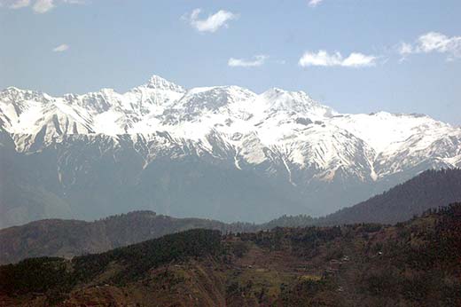 A view of snow capped mountains in Pir Panjal range .