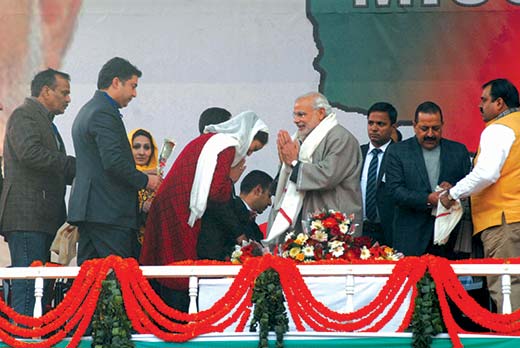 Dr Hina Bhat bows in front of Indian Prime Minister Narendra Modi during his Srinagar rally. Pic: Bilal Bahadur