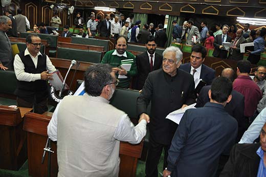 Dr Haseeb Drabu being congratultaed by former CM Mufti after presenting budget in JK assembly in 2015.