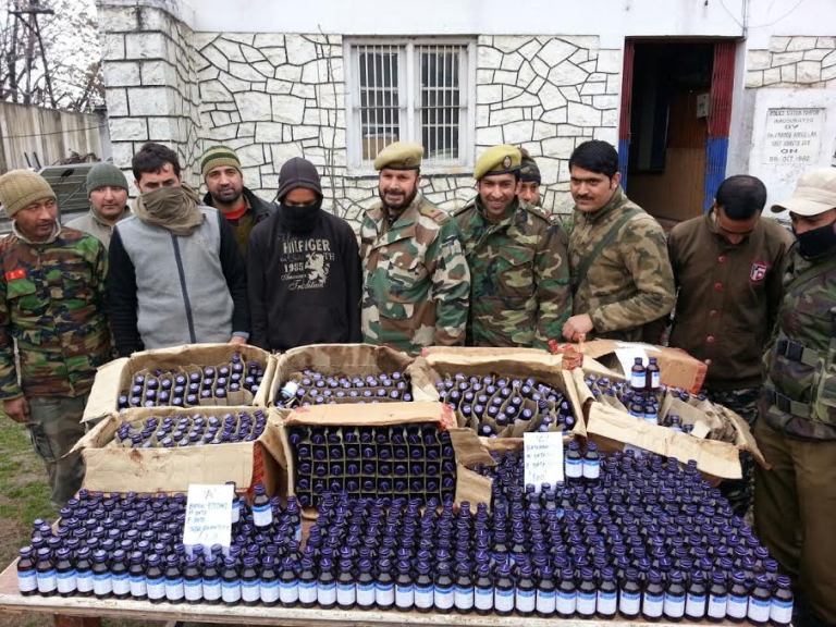 Pampore police with seized Codeine Phosphate contraband and peddlers.