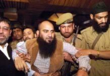 A file KL Image of Masarat Alam being arrested in 2010 uprising.