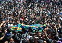 Amid Clashes and Moist Eyes, Khalid Laid to Rest