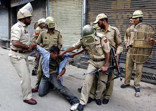 A youth being taken into custody during protests in this file photo. Pic: Bilal Bahadur