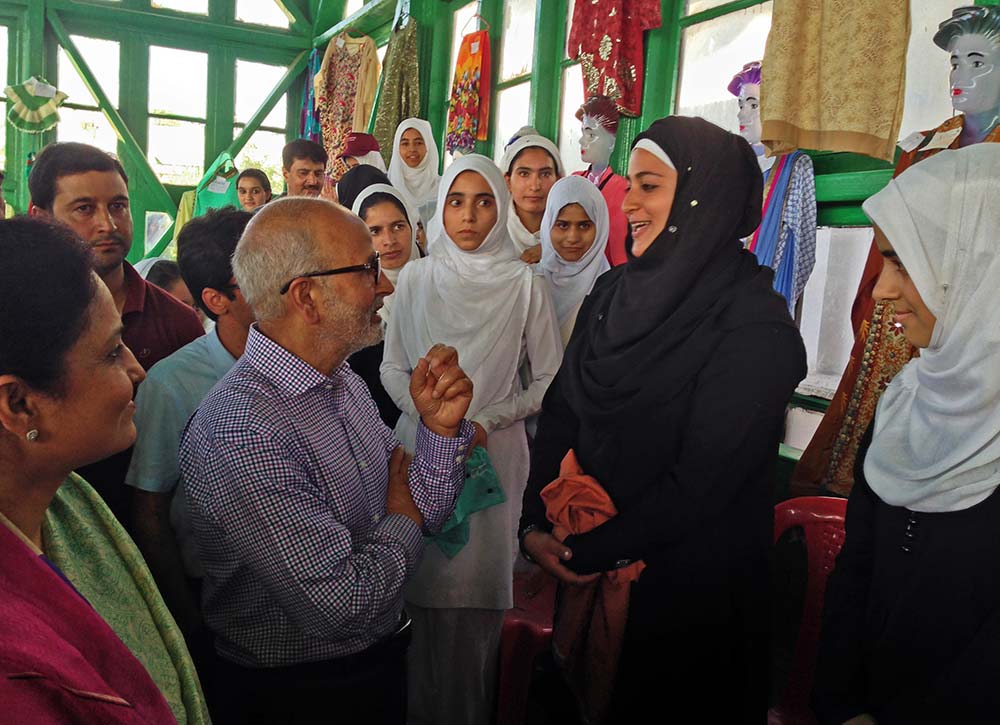 Interaction: Education Minister, Naeem Akhtar, talking to a student who designed a dress.