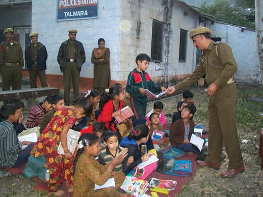 Cops taking class of students in Police Station, Talwara, Jammu.