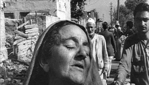 A woman sobbing after finding her house gutted in 1965 fire at Batamaloo.