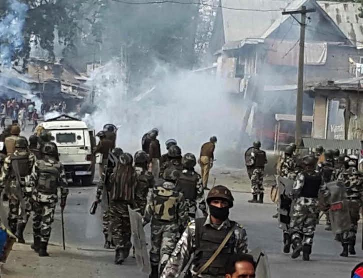 Police use teargas smoke to disperse protestors as Kashmiri Muslim villagers gather near the house of Zahid Ahmed before his body arrived at Batango village, south of Srinagar, Sunday, Oct. 18, 2015. Zahid, who was injured in the October 9 fire-bomb attack on a truck in Udhampur died at a safdar Jung hospital in New Delhi early on Sunday. PHOTO BY BILAL BAHADUR