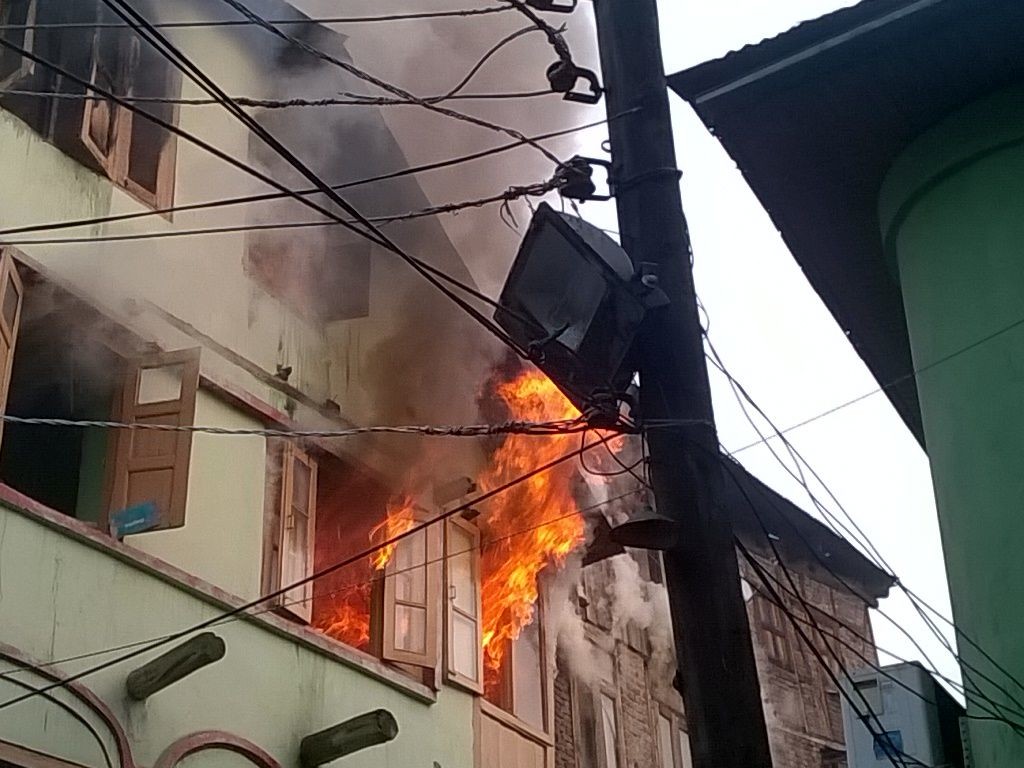 A house on fire at Nawa Kadal.