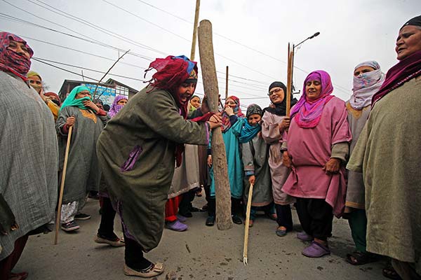Srinagarities protesting against the implementation of NFSA in J&K.