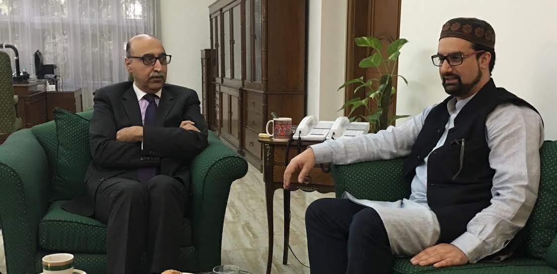 Mirwaiz Umar with Pak High Commissioner Abdul Basit in New Delhi on Monday.