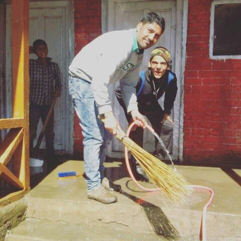 Zubair Khan cleaning his school. This photo went viral on social media.