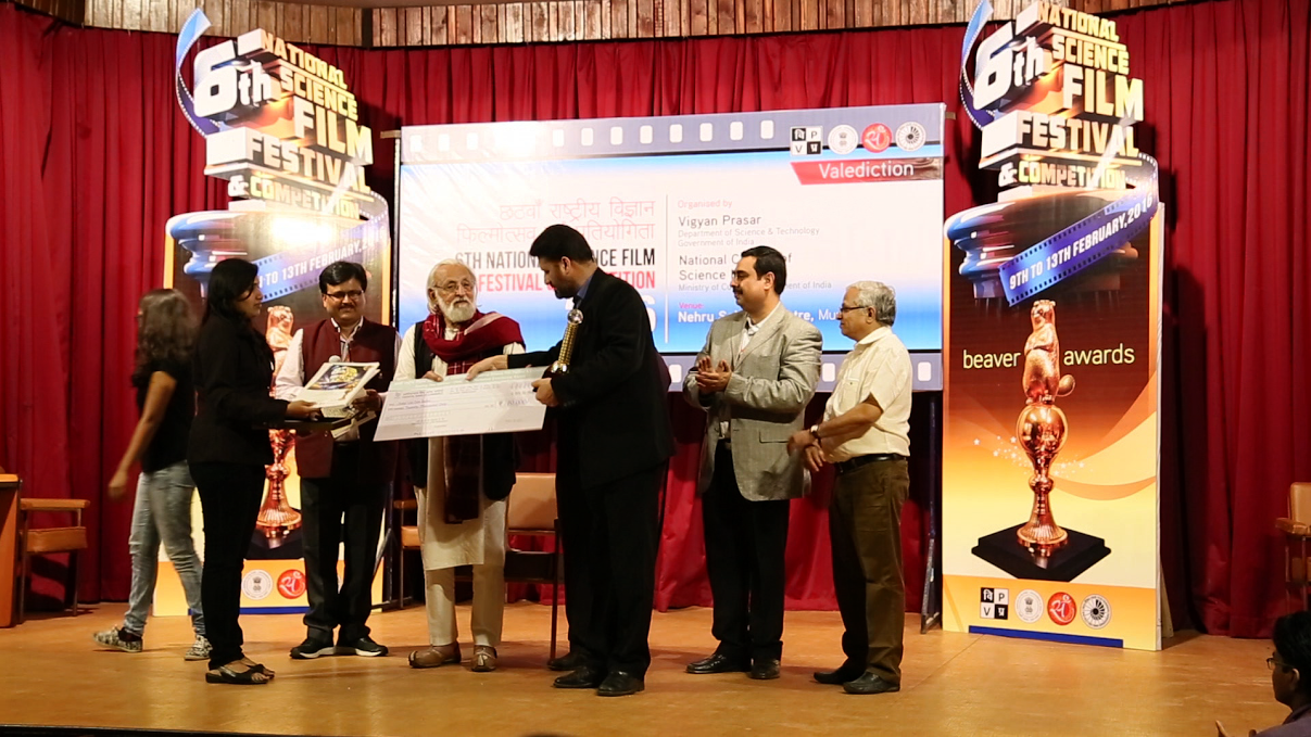 Film maker Jalal-u-Din receiving the award.