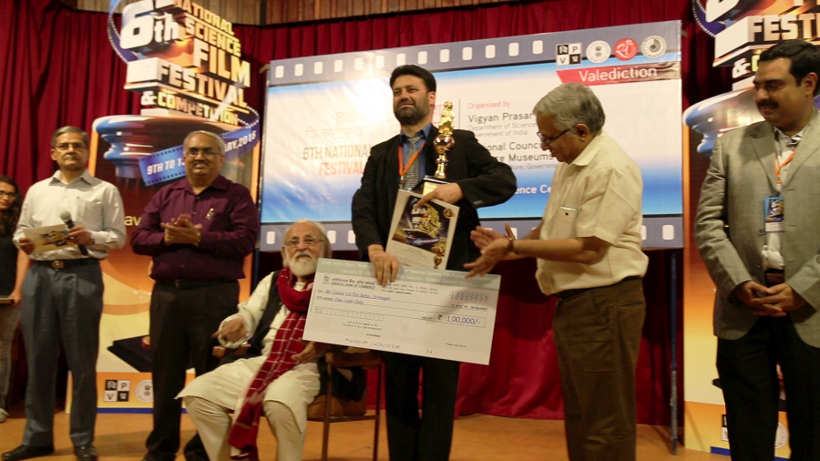 Film maker Jalal-u-Din receiving the award.