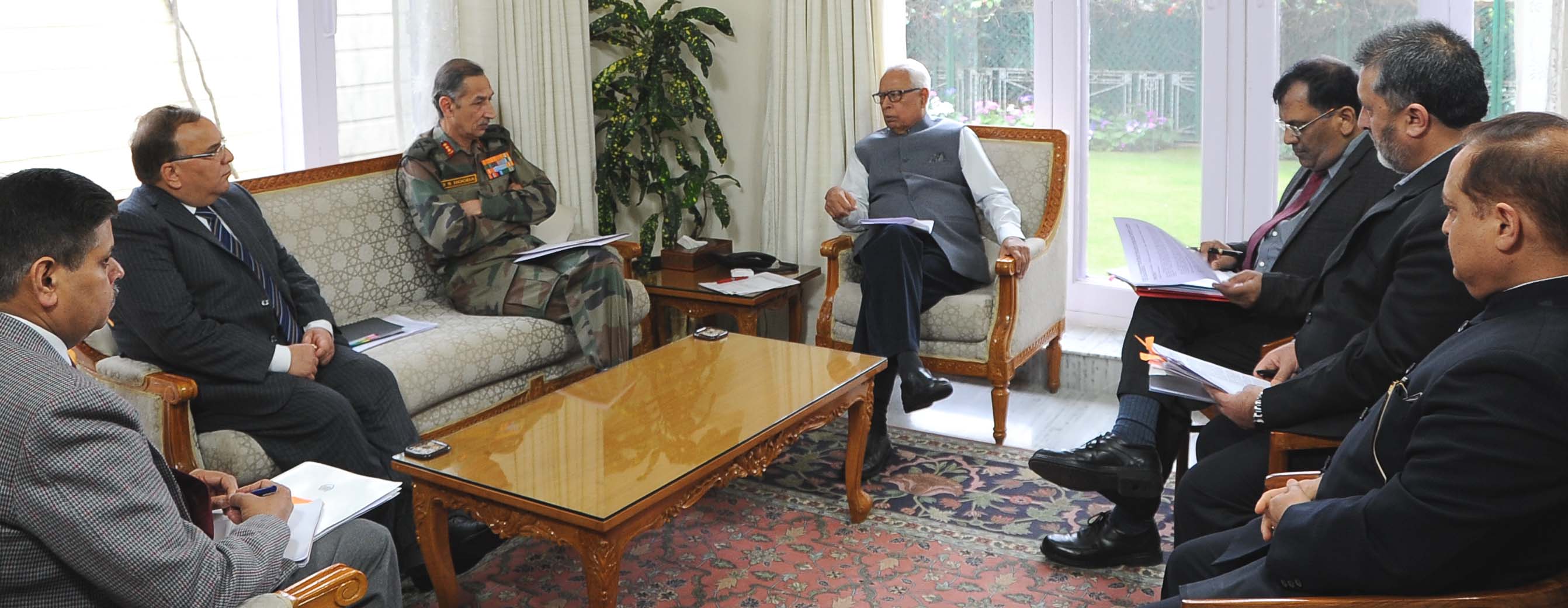 Governor reviewing Land Issues in a meeting at Raj Bhavan