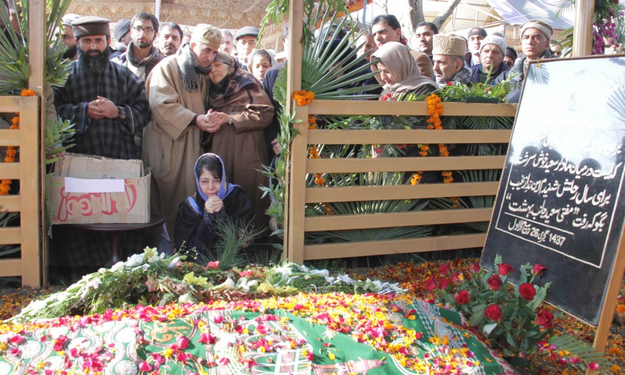 Mehbooba offering prayers at her father's graveyard in Bijbehara.