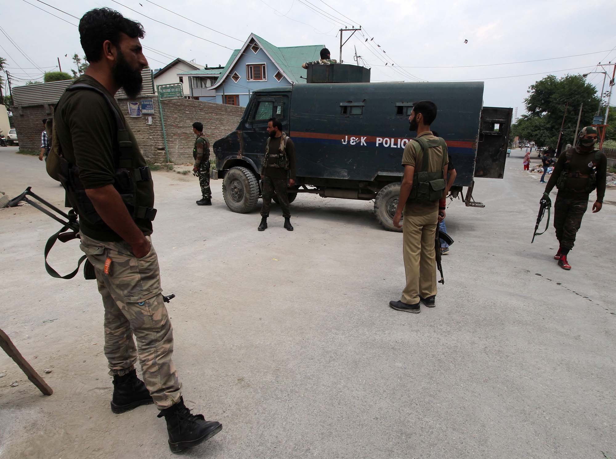 An policeman stands alert near the shootout spot in Zadibal area of Srinagar on May 23, 2016. Two policemen were shot dead by suspected militants early morning in Srinagar. Police said PHOTO BY BILAL BAHADUR