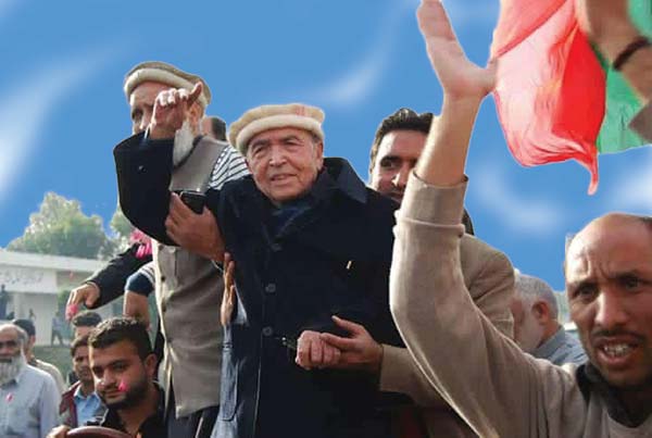 Amanullah Khan addressing a party rally.