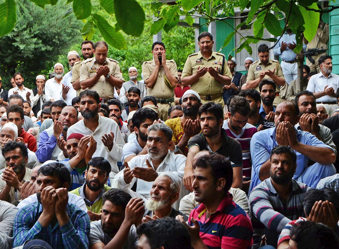 Cops praying for the departed souls of their slain colleagues. 