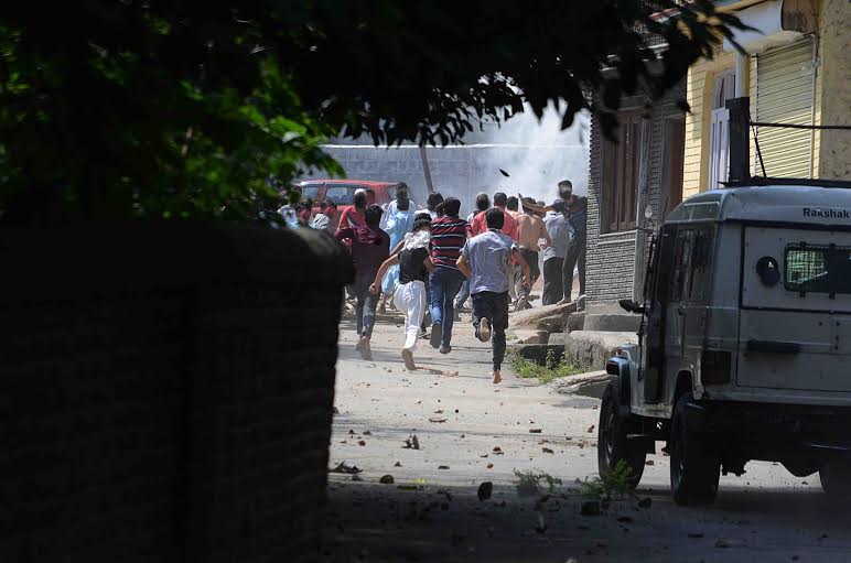 Clashes erupted in Srinagar near UN Office after a peaceful rally was intercepted by police from proceeding towards UN Office on Friday. (KL Image: Bilal Bahadur)
