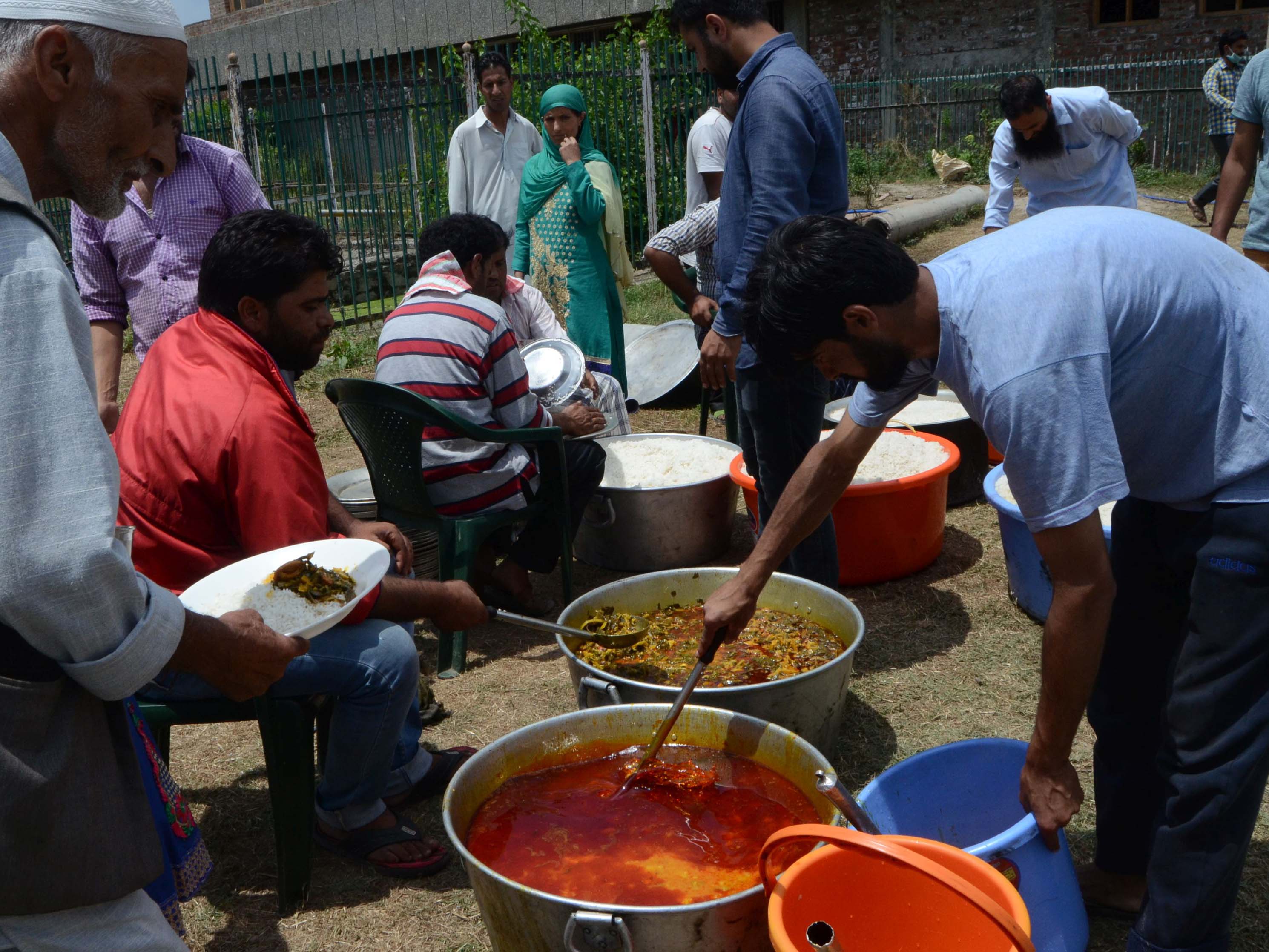 The volunteers from Anchaar area prepare two-times food for at least 800 people every day at SKIMS Soura.