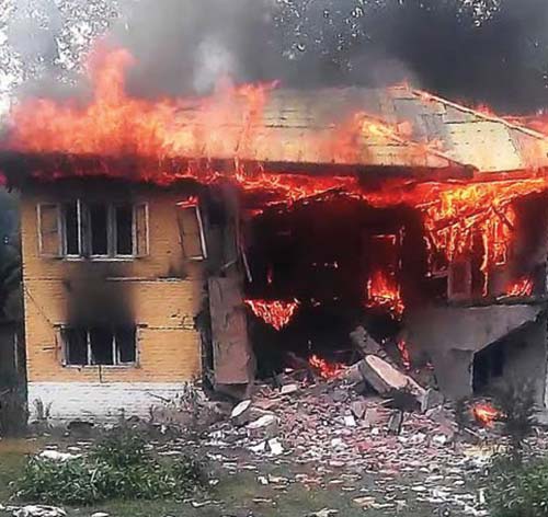 In picture, DH Pora Police Station on fire.