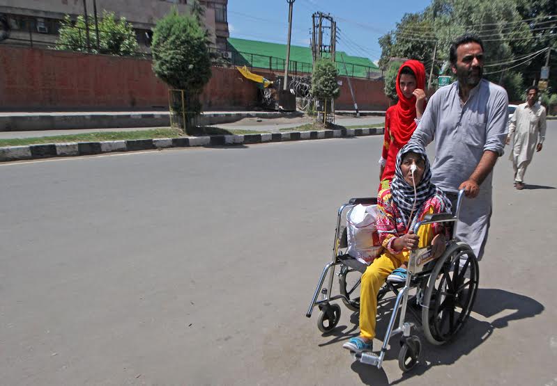 A patient being taken home from a Srinagar hospital on August 04, 2016 as curfew remained imposed and Kashmir observed shutdown on 27 day of mass uprising. (KL Image: Bilal Bahadur)