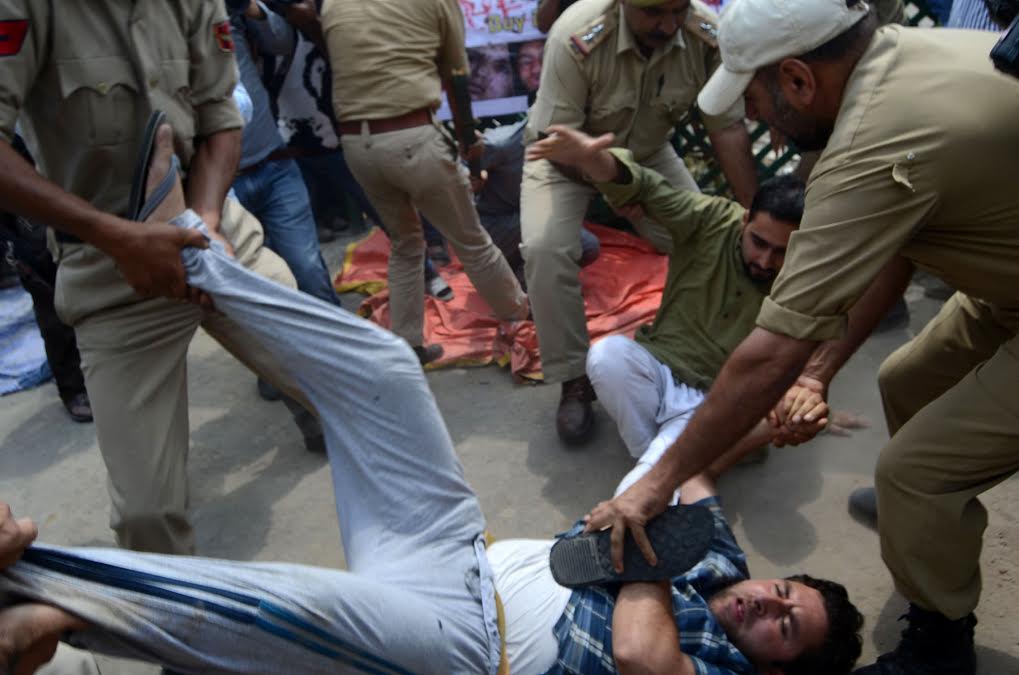 AIP activist being taken to Kothi Bagh Police Station thus preventing the party from holding hunger strike against "insensitivity" of Union Government towards Kashmir.