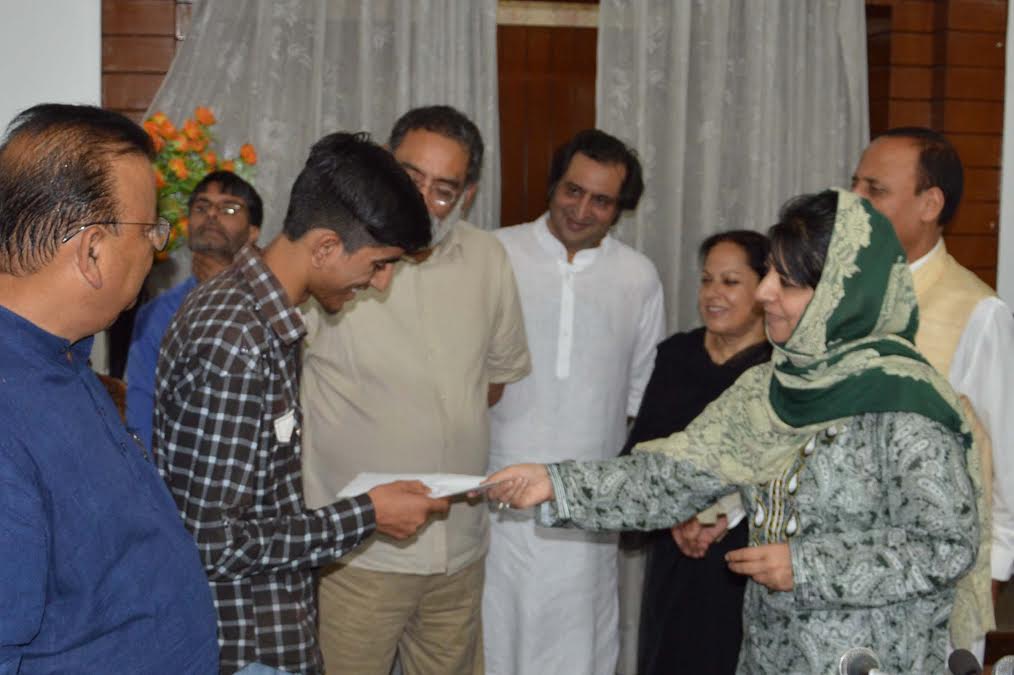 CM Ms Mehbooba Mufti giving away cheques