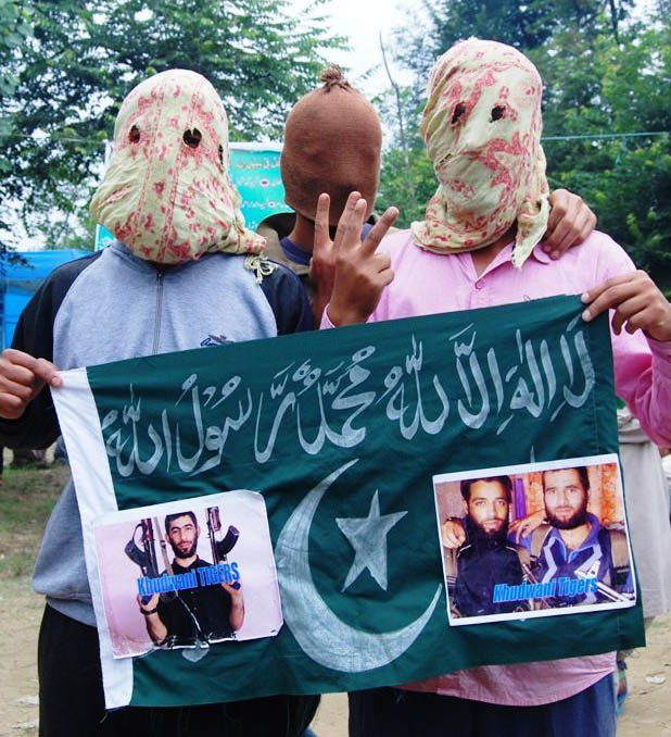 Protesters displaying banners during a rally at Khudwani. Photo: Shah Hilal. 