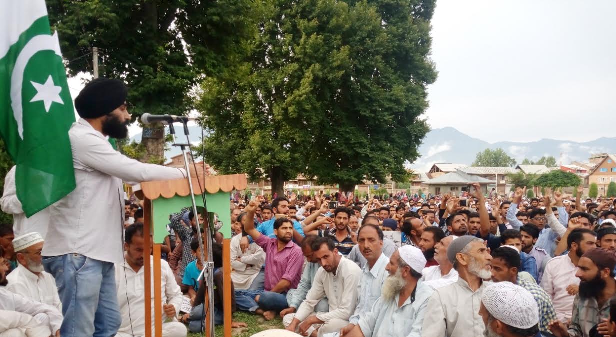 Davinder Singh addressing people at Jinab Sahab Soura on Monday.