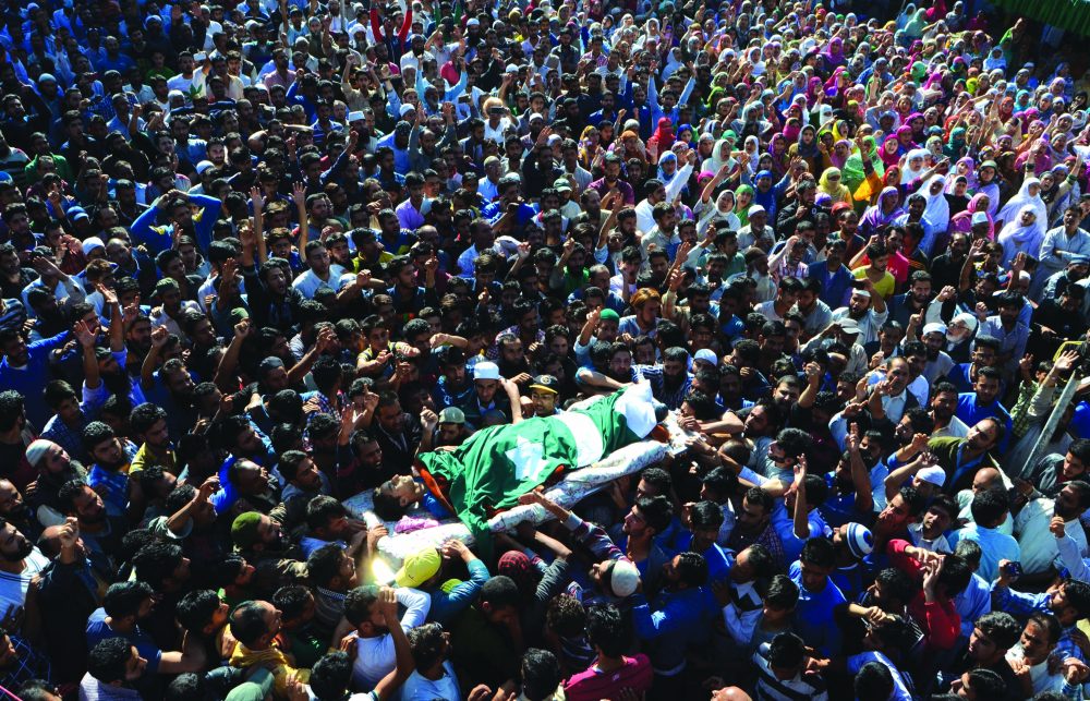 People on Saturday carry the body of 11-year-old school boy Nasir Shafi of Srinagar’s Harwan who was killed in pellet firing on Friday at Harwan. (Photo: Bilal Bahadur/KL)