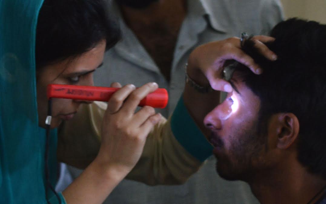 A pellet hit victim  being treated by a doctor at SMHS Hospital Srinagar on Sep 08, 2016. (KL Image: Bilal Bahadur)