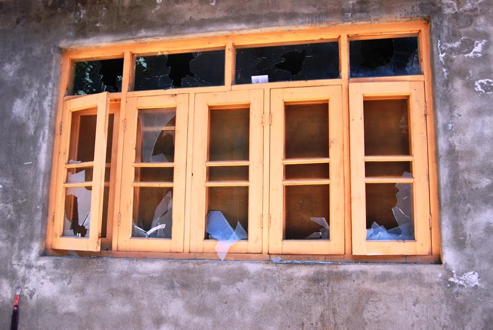Forces damaged window panes and other private property in Fatehpora area of Islamabad on Sunday. (KL Image: Shah Hilal)