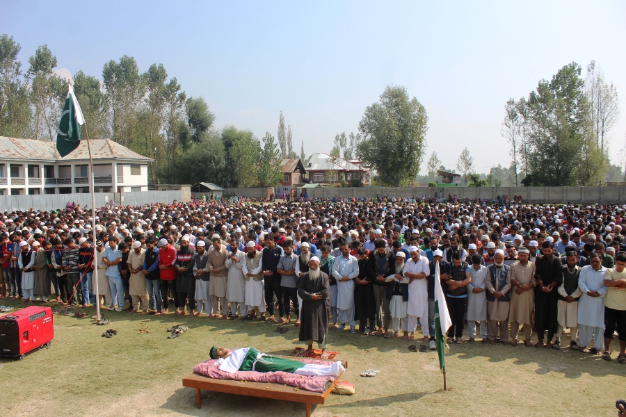 Father of slain youth Waseem Nazeer Lone leading his son's funeral prayers. (Photos: Mohammad Abu Bakar/KL)