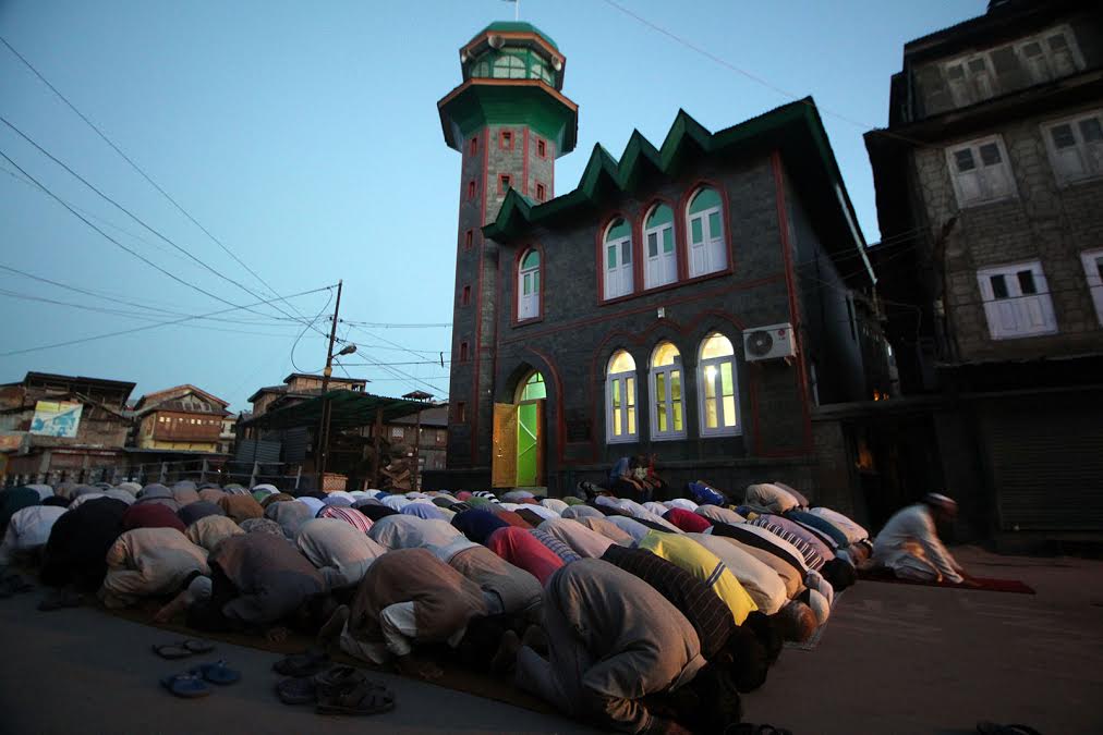 In this KL Image by Umer Asif, faithful offered Maghrib prayers in open in Kani Kadal area of Srinagar on Sep 03, 2016.