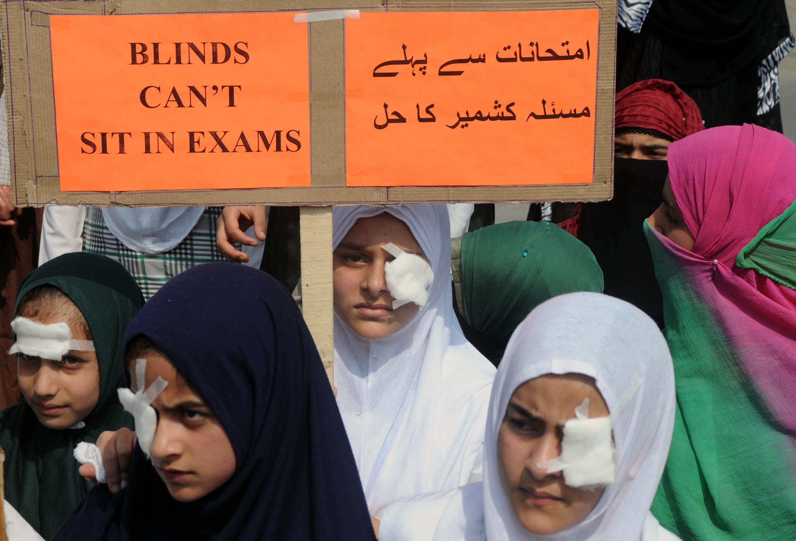 Students closed their one eye as a mark of solidarity with pellet hit victims in Pantha Chowk area of Srinagar on Sep 29, 2016. PHOTO BY BILAL BAHADUR