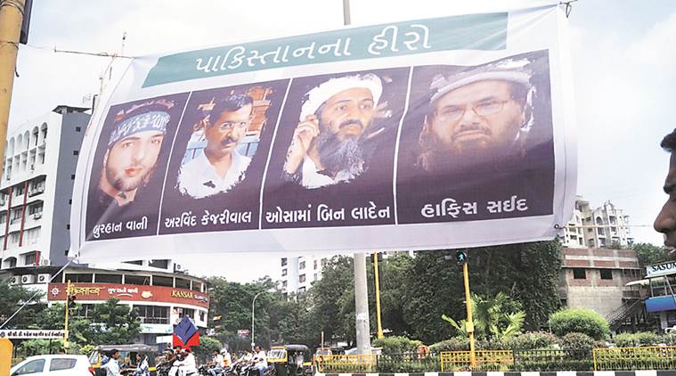 Banners featuring Arvind Kejriwal, Osama bin Laden, Hafiz Saeed and Burhan Wani in Surat on Thursday. (KL Image courtesy: The Indian Express)