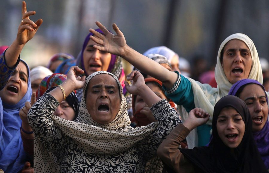 Kashmiri Muslim women shout slogans over the killing of a 12-Year old School student, Junaid Ahmad Akhoon, during his funeral procession at Saidapora area of Eidgah in Downtown Srinagar. (Photo: Bilal Bahadur/KL)